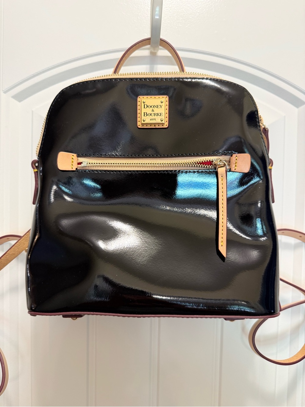 Dooney & Bourke Black Patent Leather Backpack with Tan Trim